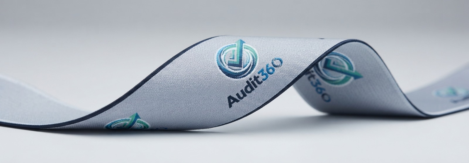 AI-generated photorealistic preview of a woven Audit360 branded elastic sample